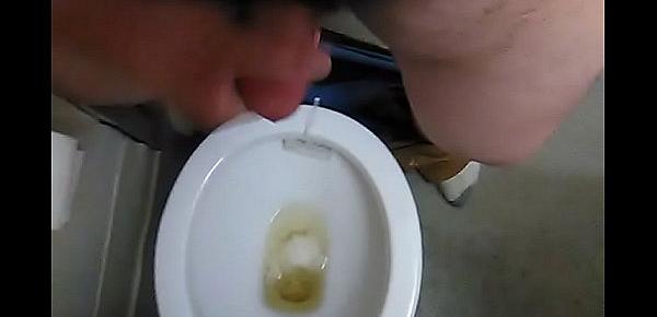  Pissing and stroking tiny cock